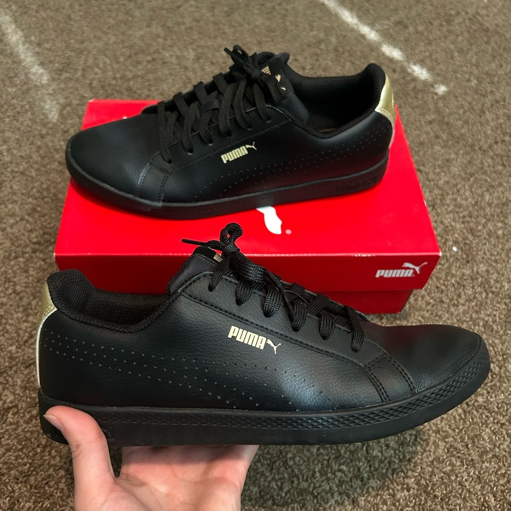 Puma Black and Gold Sneakers